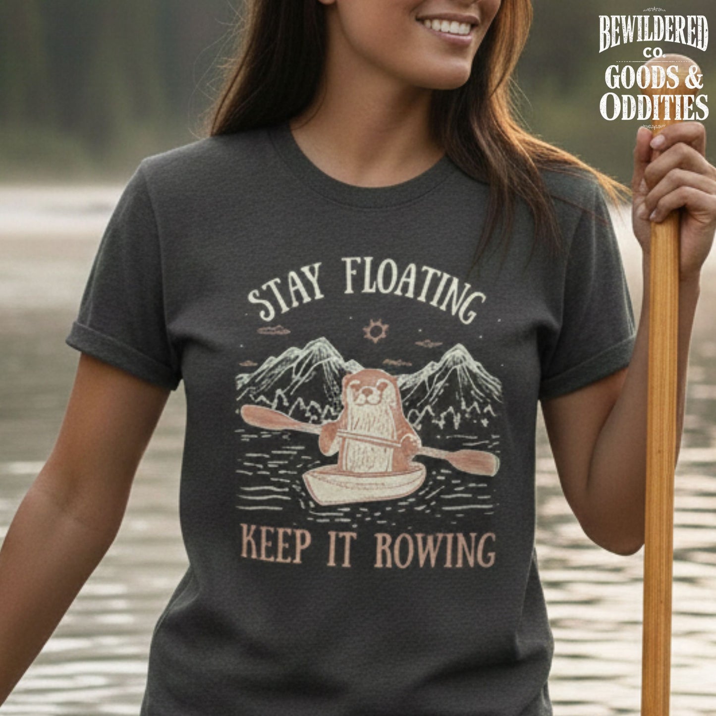 River Queen T-Shirt — Cute Otter Canoe Graphic Tee for Outdoor Lovers